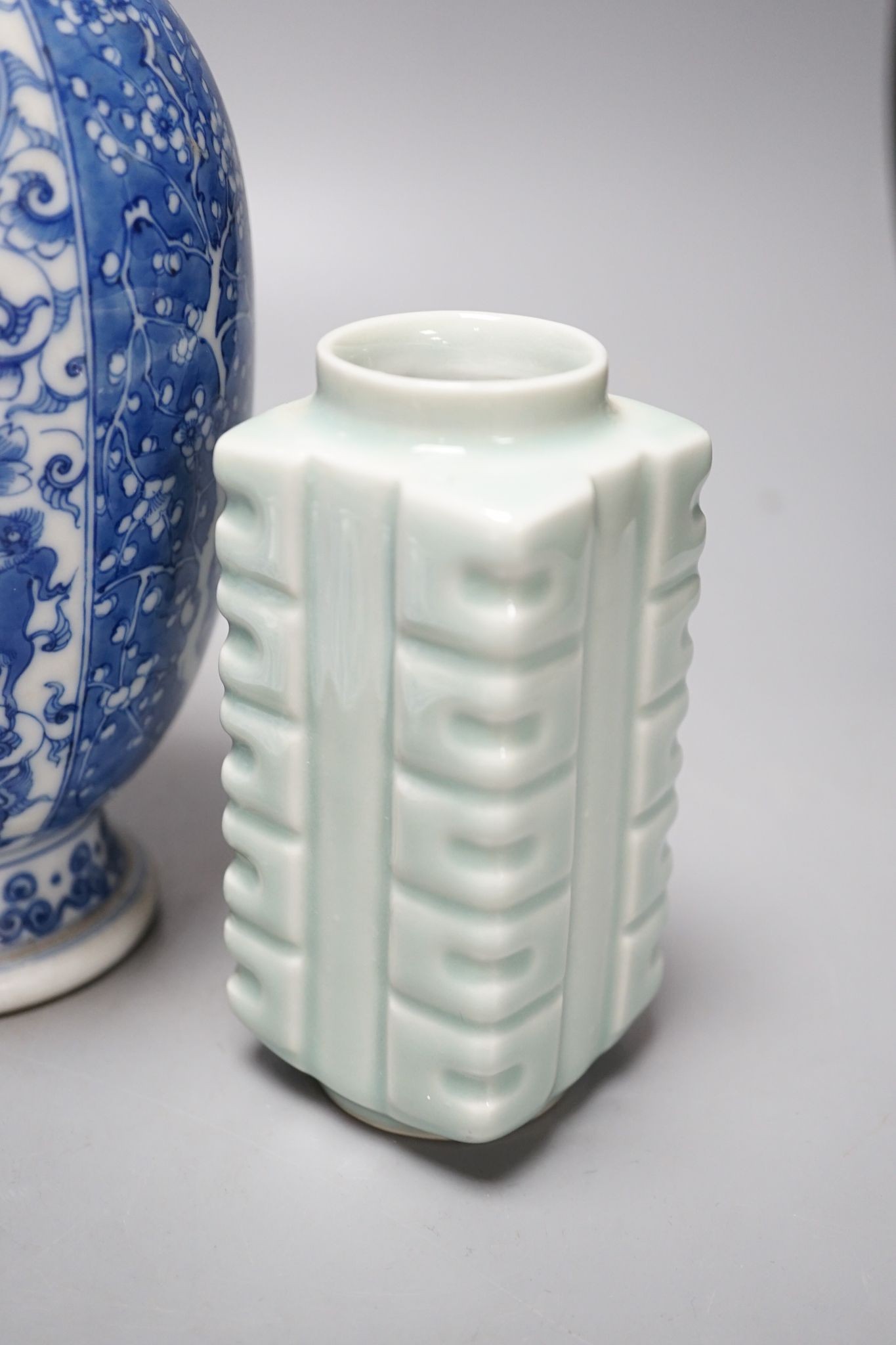 A Chinese blue and white ovoid vase, 20cm a similar dish and plates and celadon glazed vase